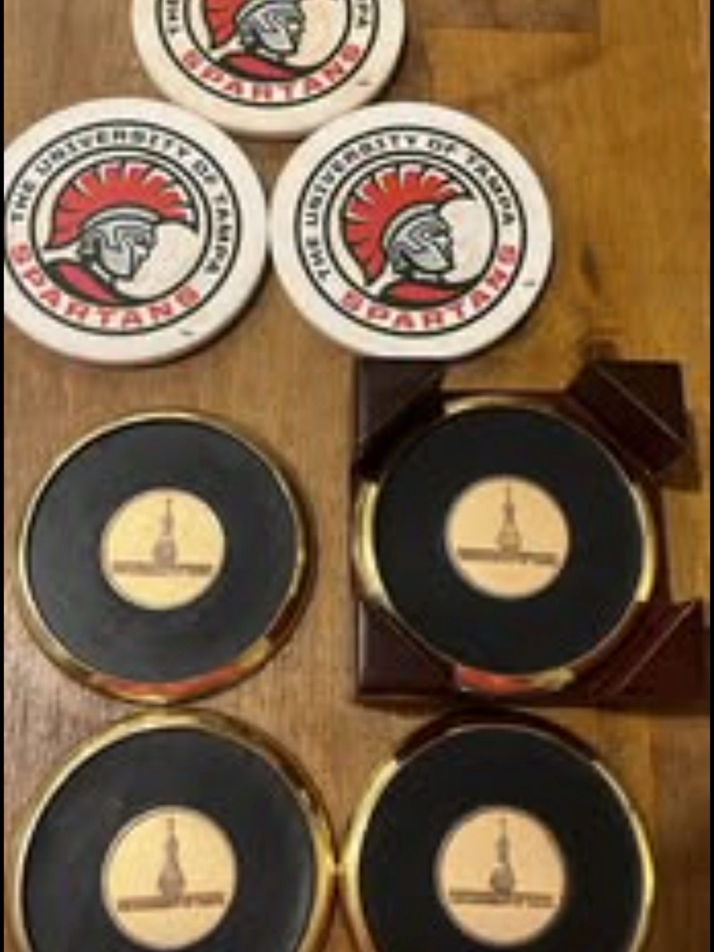 7 UT  University of Tampa Spartans coasters. With holder.